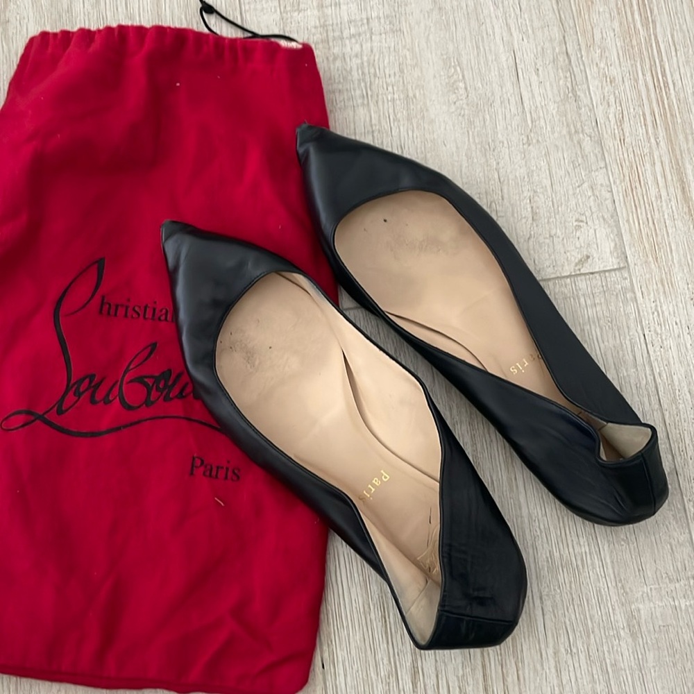 Black Louboutin flats